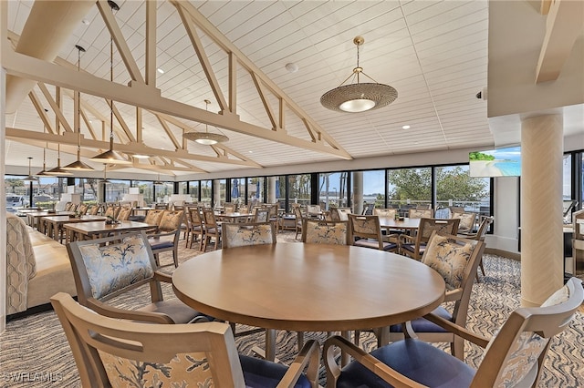 dining space with beam ceiling, high vaulted ceiling, and wooden ceiling