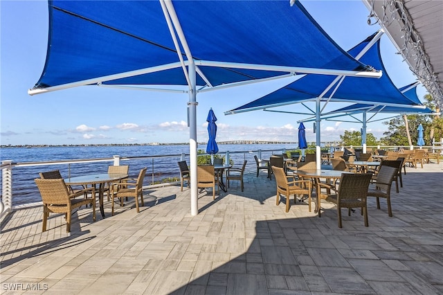 view of patio with a water view