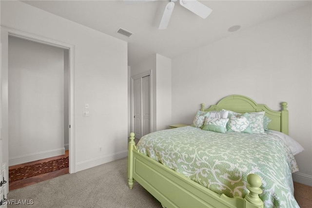 bedroom with a closet, carpet flooring, and ceiling fan