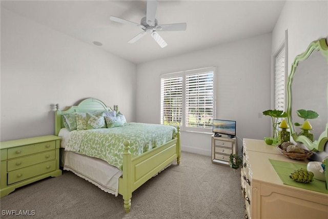 bedroom featuring light carpet and ceiling fan