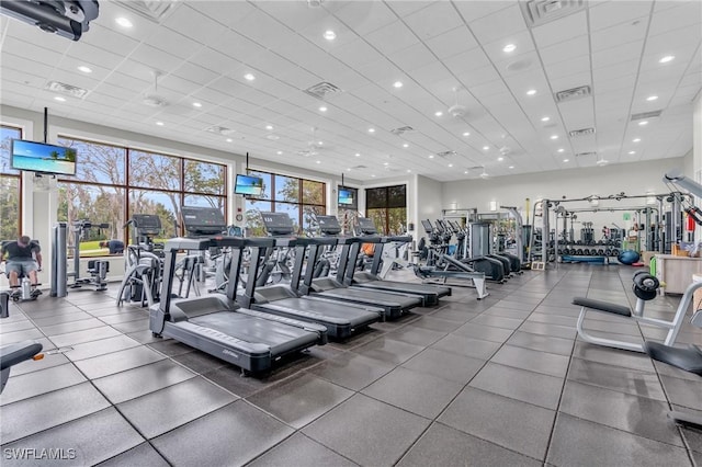 exercise room featuring a drop ceiling