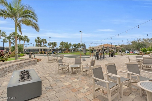 view of patio / terrace with an outdoor fire pit