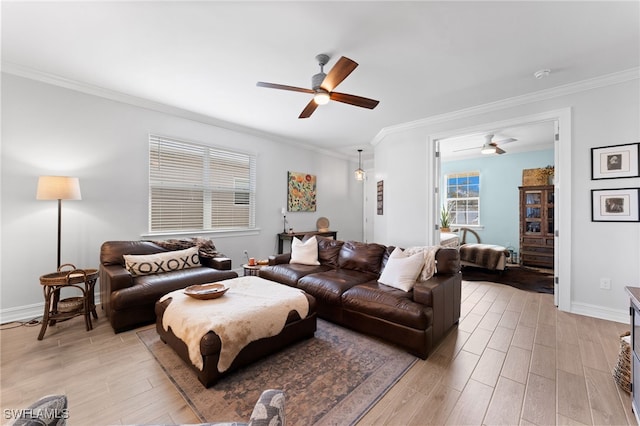 living room featuring crown molding and ceiling fan