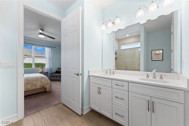 bathroom featuring vanity, a shower with door, and ceiling fan