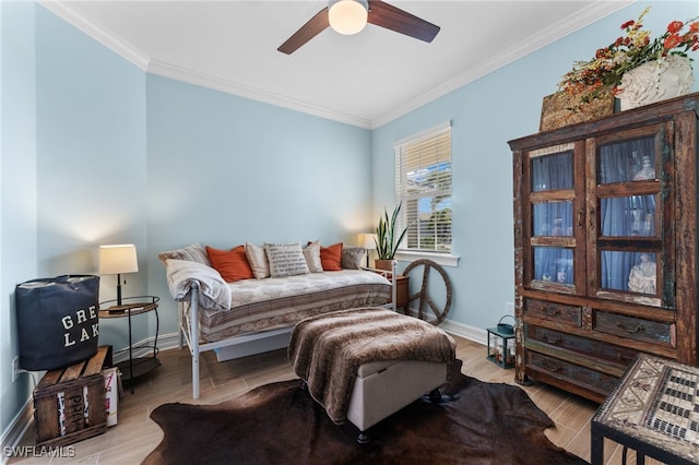 sitting room featuring crown molding, ceiling fan, and light hardwood / wood-style floors