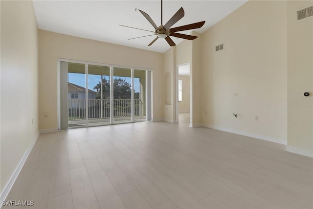 spare room featuring light hardwood / wood-style floors and ceiling fan