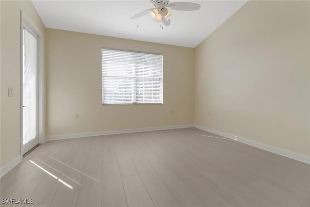 empty room featuring light hardwood / wood-style flooring and ceiling fan