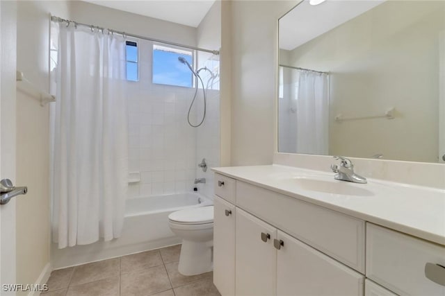 full bathroom featuring tile patterned floors, toilet, shower / tub combo, and vanity