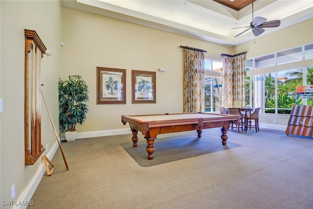 rec room with a raised ceiling, carpet flooring, ceiling fan, and billiards