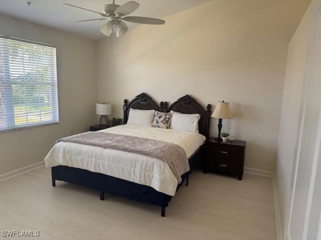 3065 Driftwood Way Unit 4206, Naples, FL 34109 - bedroom featuring baseboards and ceiling fan