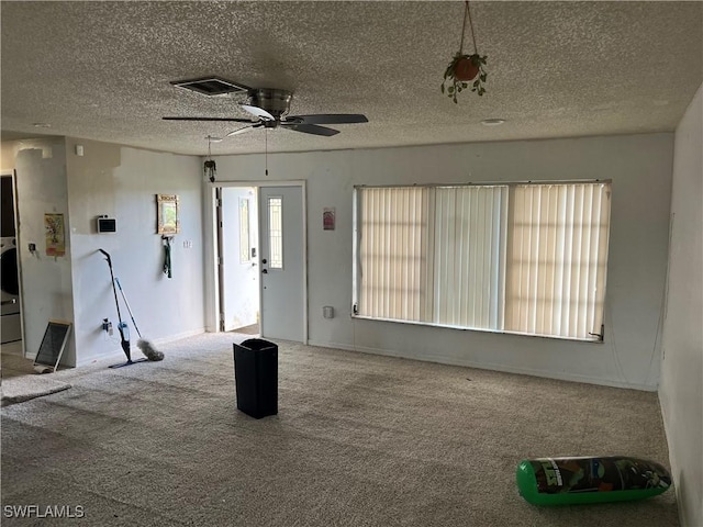 interior space featuring carpet flooring and ceiling fan