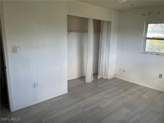 unfurnished bedroom with a closet