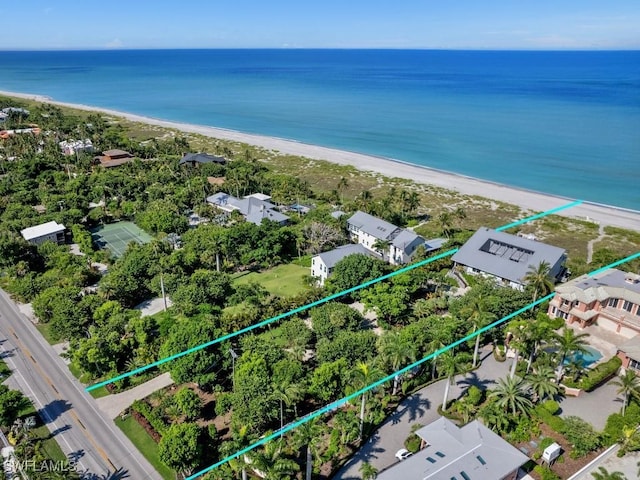 bird's eye view featuring a view of the beach and a water view