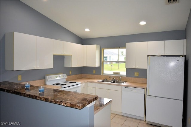 kitchen with white cabinetry, sink, kitchen peninsula, lofted ceiling, and white appliances