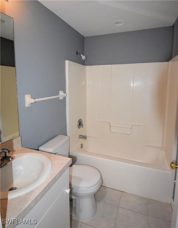 full bathroom featuring bathtub / shower combination, vanity, tile patterned floors, and toilet