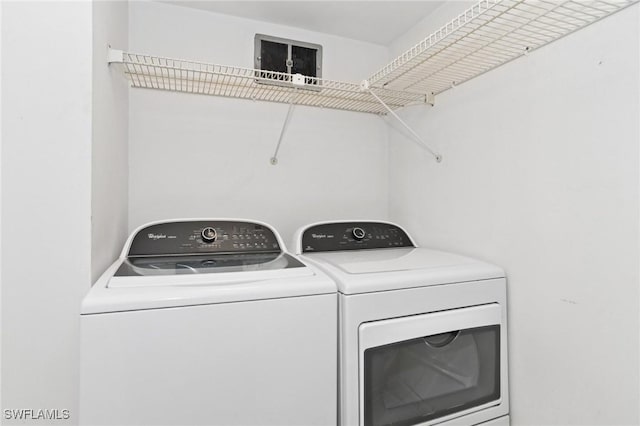 laundry area with washing machine and dryer and laundry area