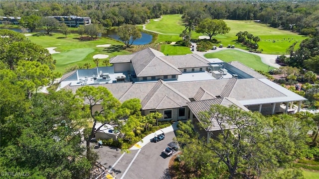 bird's eye view featuring a water view and view of golf course