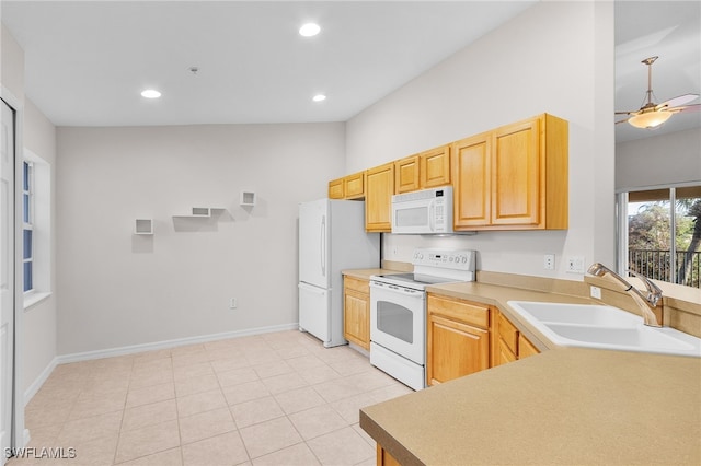 kitchen featuring ceiling fan, sink, white appliances, light brown cabinetry, and light tile patterned floors