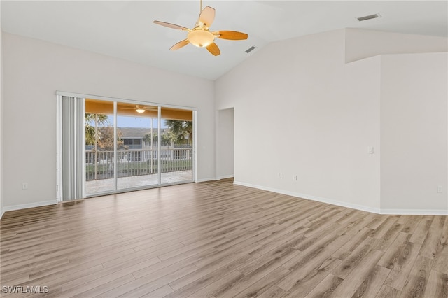 empty room featuring ceiling fan, light wood-type flooring, and lofted ceiling