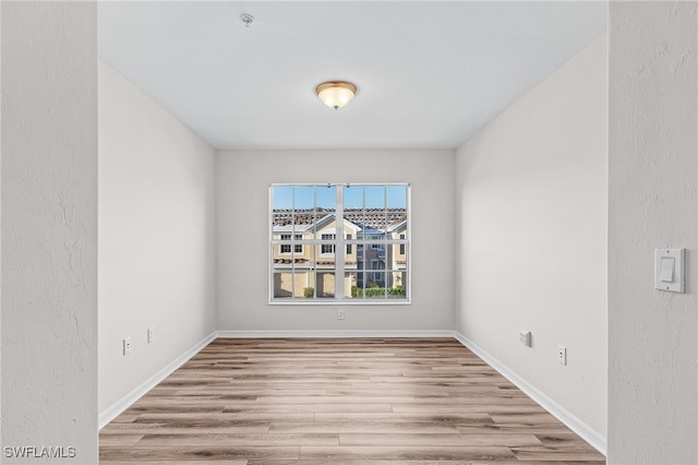 spare room featuring light hardwood / wood-style floors