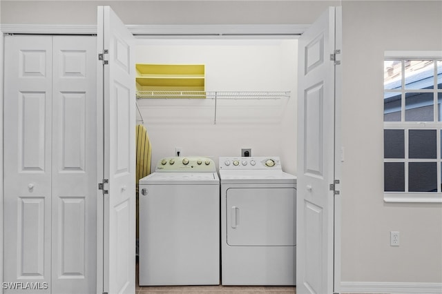 laundry room with washing machine and dryer