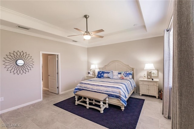 bedroom featuring a tray ceiling, ceiling fan, and crown molding