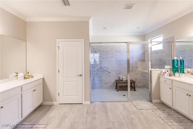 bathroom featuring vanity, crown molding, and walk in shower