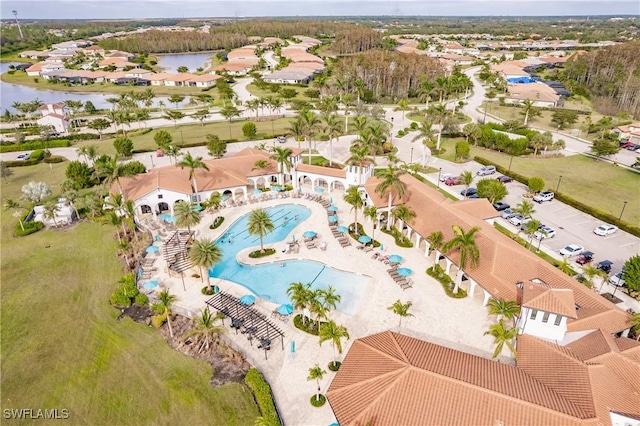 birds eye view of property featuring a water view