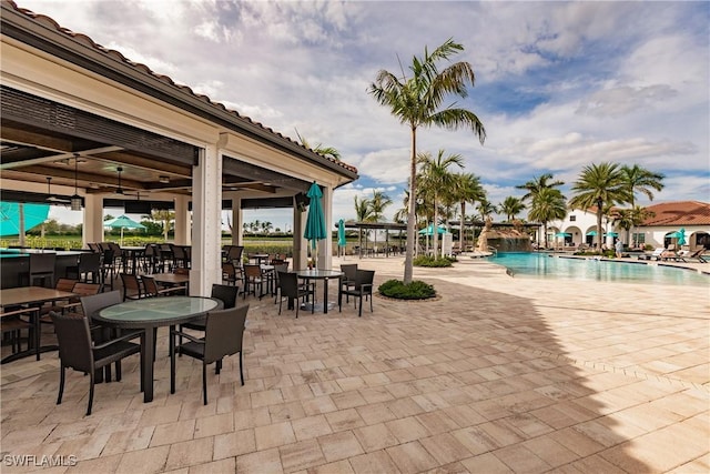11973 Bay Oak Dr, Fort Myers, FL 33913 - view of patio with a community pool