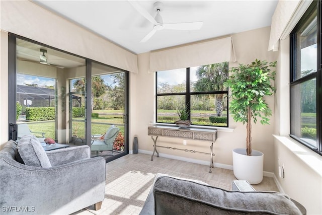 sunroom featuring ceiling fan