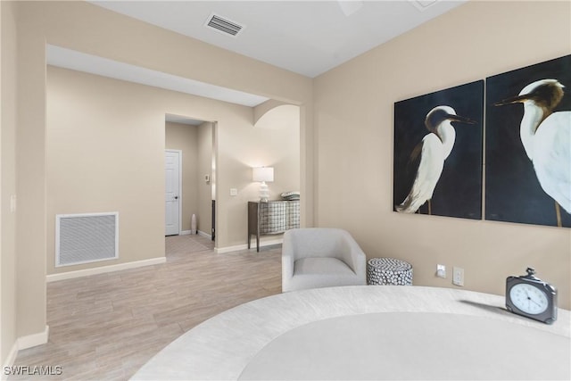 sitting room with light hardwood / wood-style flooring