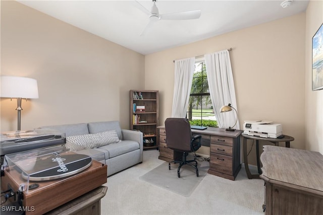 office space featuring light colored carpet and ceiling fan