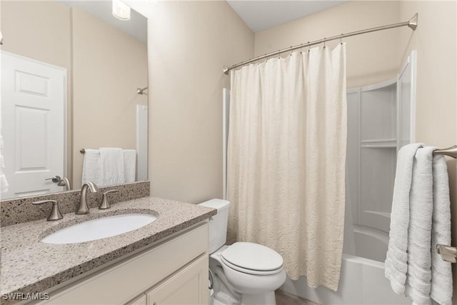 full bathroom featuring vanity, toilet, and shower / tub combo