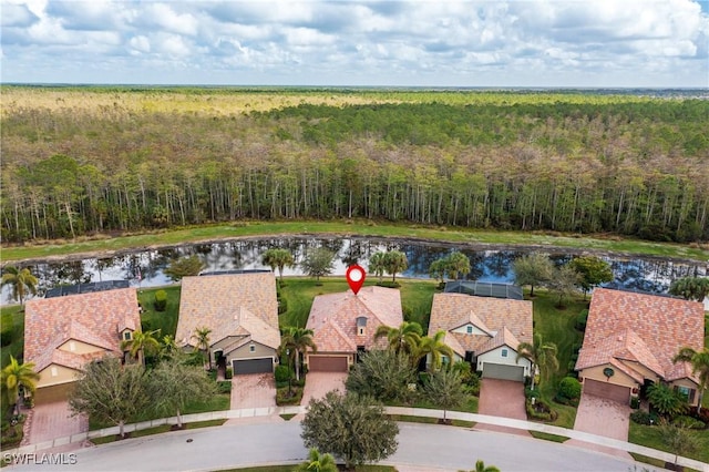 7370 Mockingbird Ct, Naples, FL 34114 - aerial view featuring a wooded view and a water view