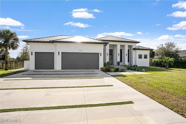 view of front facade with a garage and a front yard