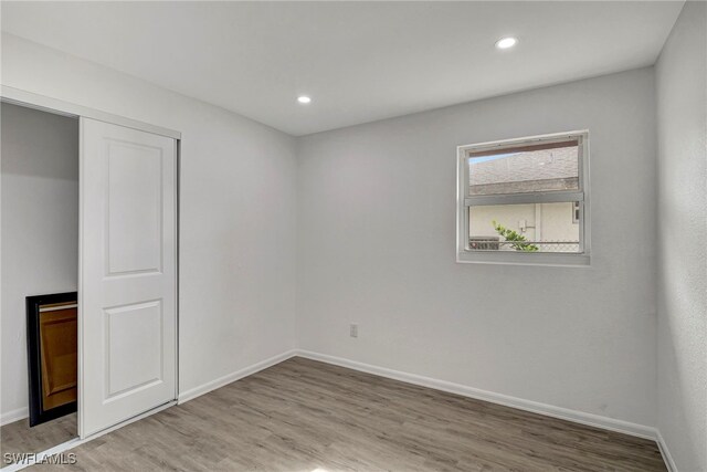 unfurnished bedroom with light hardwood / wood-style flooring