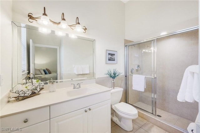 bathroom with vanity, an enclosed shower, tile patterned floors, and toilet