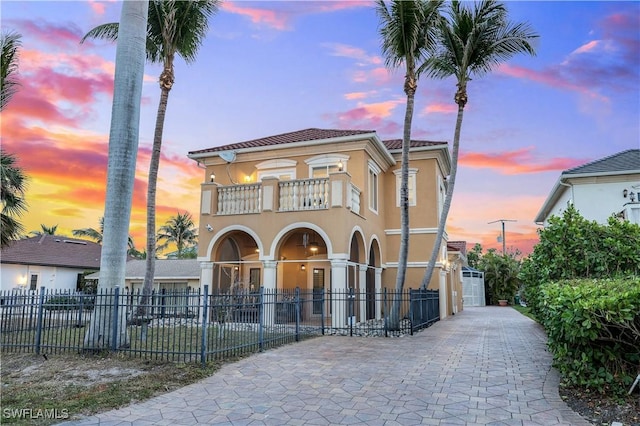 mediterranean / spanish house with a balcony