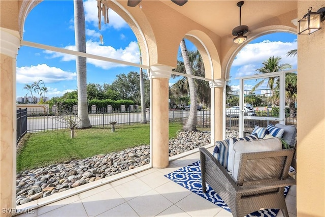 view of patio featuring ceiling fan