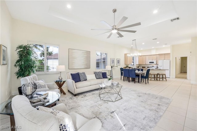 living room with light tile patterned flooring and ceiling fan