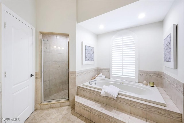 bathroom featuring tile patterned floors and plus walk in shower