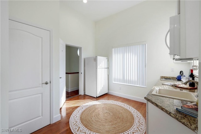 bathroom with sink and hardwood / wood-style floors