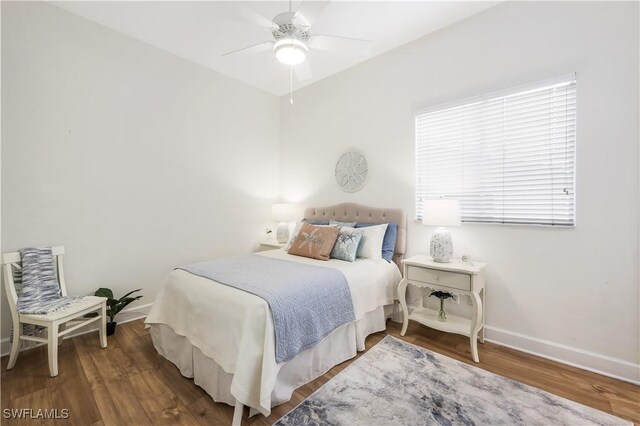 bedroom featuring hardwood / wood-style flooring and ceiling fan