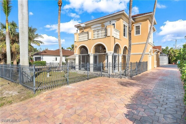 mediterranean / spanish home featuring a balcony