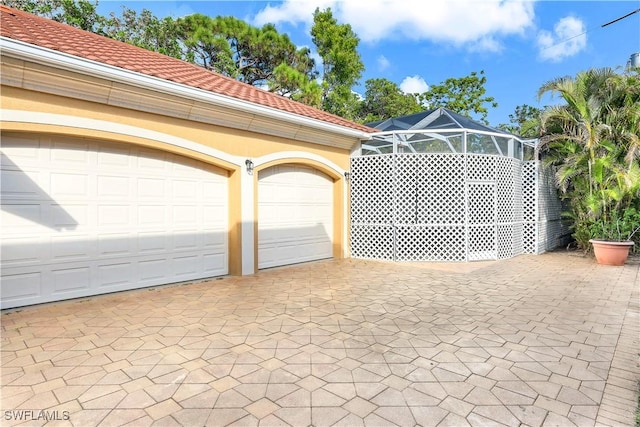 view of gate with glass enclosure