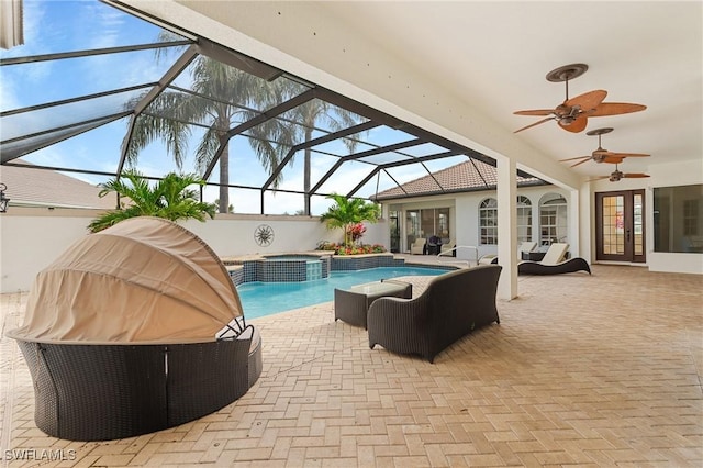 view of pool featuring french doors, an in ground hot tub, ceiling fan, an outdoor hangout area, and a patio