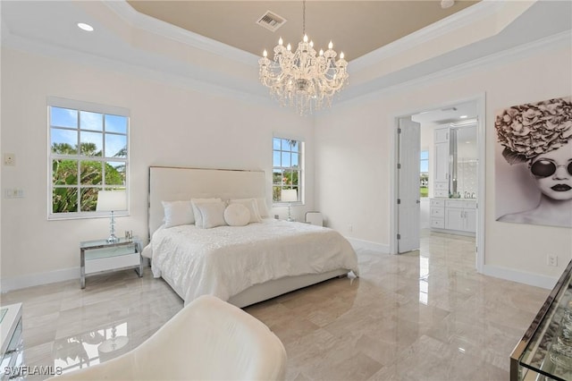 bedroom featuring crown molding, a tray ceiling, a chandelier, and ensuite bathroom