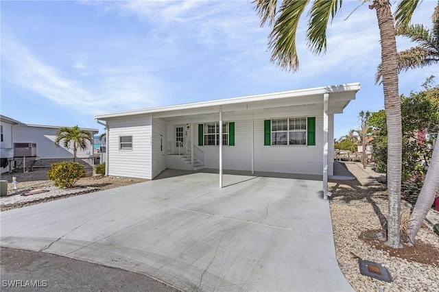 view of front facade with a carport