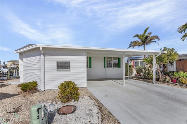 single story home featuring a carport