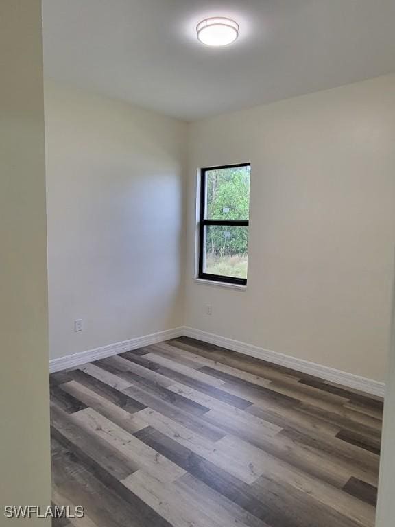 unfurnished room with hardwood / wood-style floors